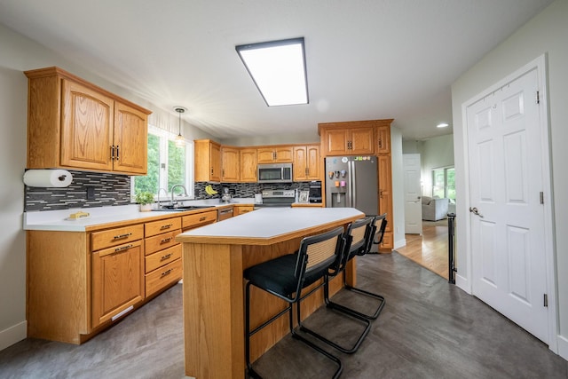 10060 E David Allen Rd, Columbia, MO 65201 - kitchen featuring appliances with stainless steel finishes, backsplash, light countertops, a sink, and recessed lighting