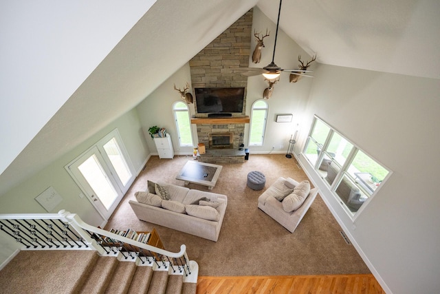10060 E David Allen Rd, Columbia, MO 65201 - living area featuring high vaulted ceiling, a fireplace, baseboards, ceiling fan, and wood finished floors