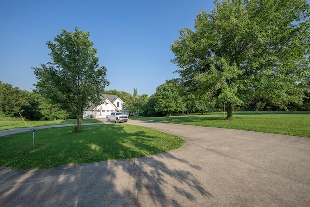 10060 E David Allen Rd, Columbia, MO 65201 - view of front facade featuring a front yard and curved driveway