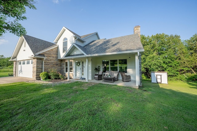 10060 E David Allen Rd, Columbia, MO 65201 - traditional-style home with a front yard, an outdoor living space, a chimney, concrete driveway, and a storage shed