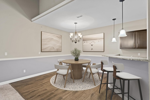 4008 W Worley St Unit 301, Columbia, MO 65203 - dining space with dark wood-style flooring and a chandelier