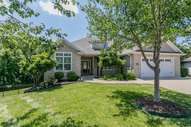 2016 Devonshire Dr, Columbia, MO 65203 - view of front of house with stone siding, driveway, an attached garage, and a shingled roof