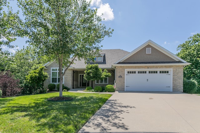 2016 Devonshire Dr, Columbia, MO 65203 - view of front of property with stone siding, a garage, a front lawn, concrete driveway, and a shingled roof