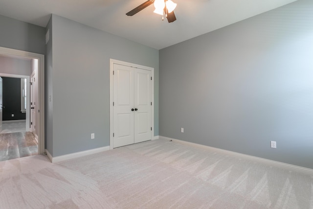 2016 Devonshire Dr, Columbia, MO 65203 - unfurnished bedroom with light carpet, a closet, and ceiling fan