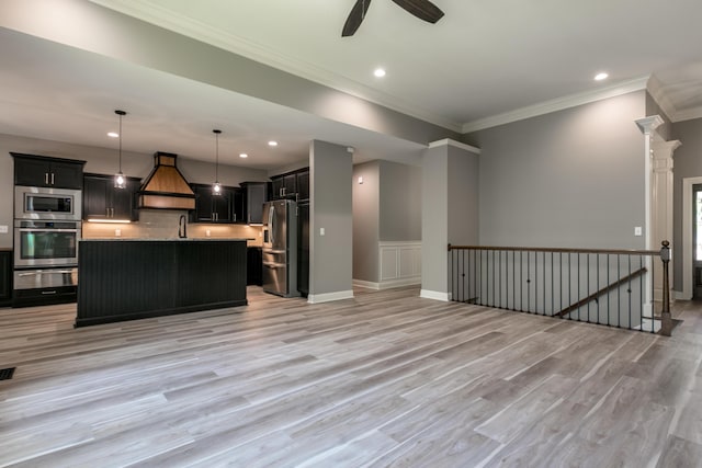 2016 Devonshire Dr, Columbia, MO 65203 - kitchen with appliances with stainless steel finishes, a warming drawer, open floor plan, a ceiling fan, and light countertops
