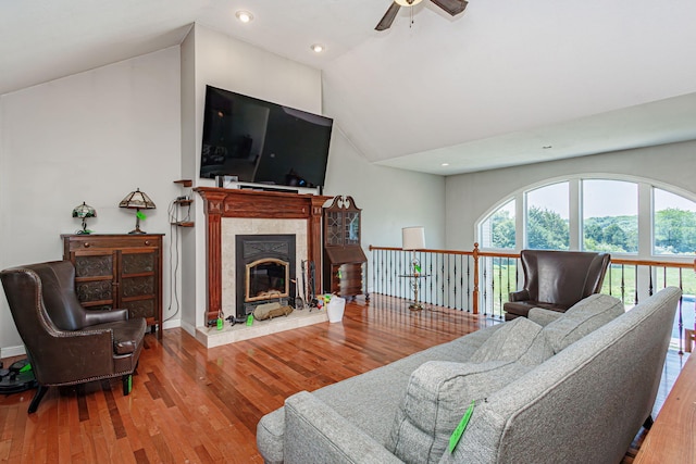 8801 S Ginn Ln, Columbia, MO 65201 - living room featuring a ceiling fan, vaulted ceiling, wood finished floors, a fireplace, and recessed lighting