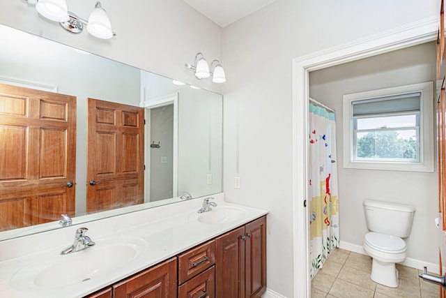 8801 S Ginn Ln, Columbia, MO 65201 - full bath with toilet, tile patterned flooring, double vanity, baseboards, and curtained shower