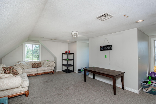 8801 S Ginn Ln, Columbia, MO 65201 - carpeted living area featuring a textured ceiling, vaulted ceiling, a ceiling fan, baseboards, and recessed lighting