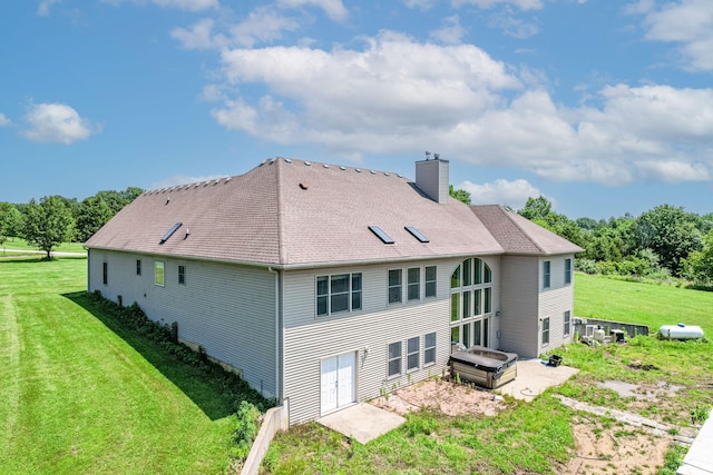 8801 S Ginn Ln, Columbia, MO 65201 - rear view of house with a chimney and a lawn