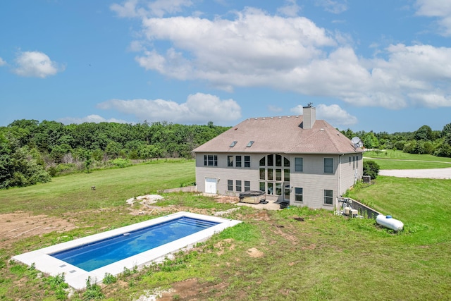 8801 S Ginn Ln, Columbia, MO 65201 - rear view of house featuring a chimney, a lawn, a covered pool, and a patio