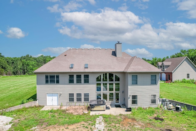 8801 S Ginn Ln, Columbia, MO 65201 - back of house with a patio area, a chimney, a lawn, and cooling unit