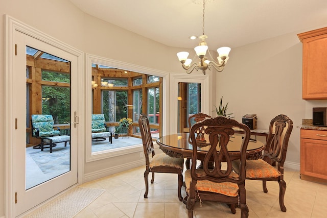 203 Foxwood Ct, Columbia, MO 65203 - dining area featuring a chandelier and light tile patterned floors