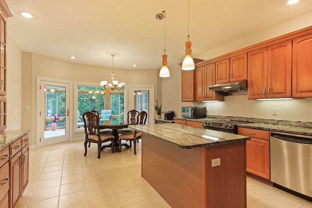 203 Foxwood Ct, Columbia, MO 65203 - kitchen with appliances with stainless steel finishes, under cabinet range hood, dark stone countertops, a chandelier, and recessed lighting