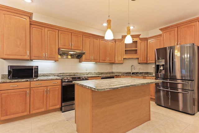 203 Foxwood Ct, Columbia, MO 65203 - kitchen featuring appliances with stainless steel finishes, under cabinet range hood, light tile patterned floors, a kitchen island, and recessed lighting