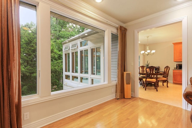 203 Foxwood Ct, Columbia, MO 65203 - sunroom / solarium featuring a chandelier and plenty of natural light