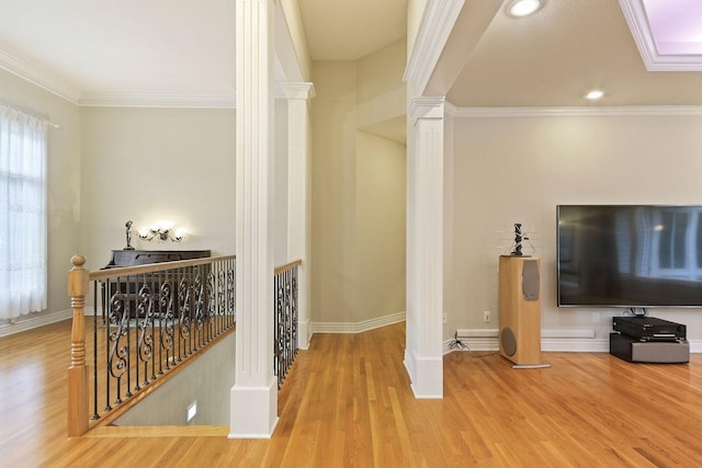 203 Foxwood Ct, Columbia, MO 65203 - hall with ornate columns, an upstairs landing, wood finished floors, crown molding, and recessed lighting