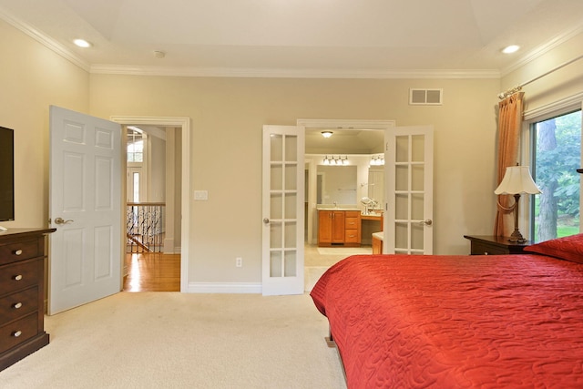 203 Foxwood Ct, Columbia, MO 65203 - bedroom with french doors, crown molding, light carpet, recessed lighting, and ensuite bath