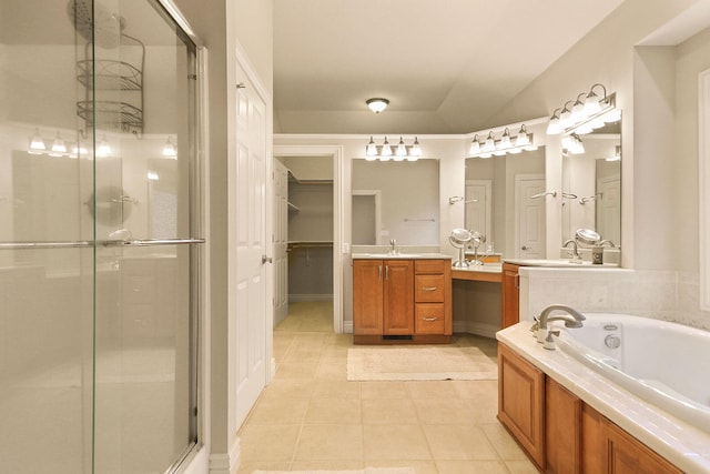 203 Foxwood Ct, Columbia, MO 65203 - bathroom with a stall shower, vanity, tile patterned floors, and a bath