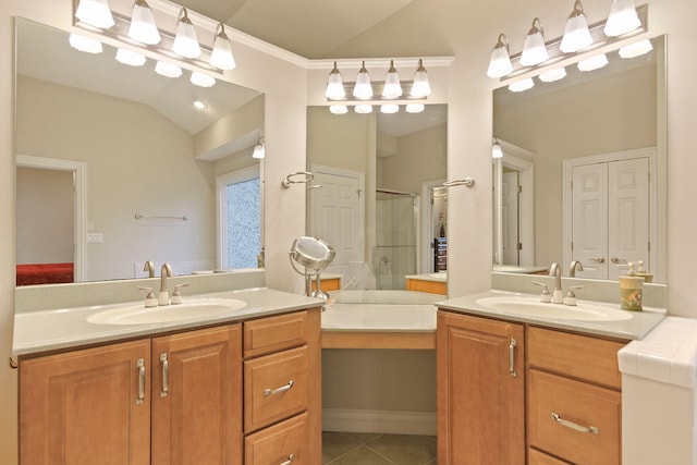 203 Foxwood Ct, Columbia, MO 65203 - full bath with vaulted ceiling, two vanities, tile patterned flooring, and a shower stall