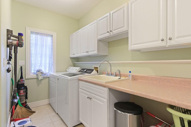 203 Foxwood Ct, Columbia, MO 65203 - washroom with separate washer and dryer, cabinet space, and light tile patterned floors