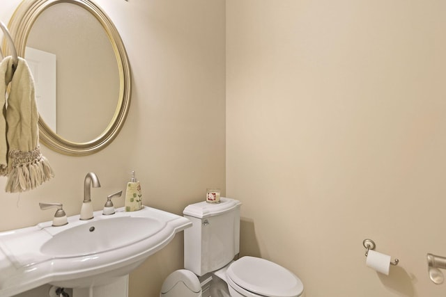 203 Foxwood Ct, Columbia, MO 65203 - half bathroom featuring toilet and a sink