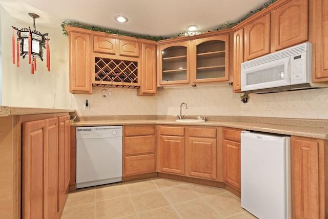 203 Foxwood Ct, Columbia, MO 65203 - kitchen with white appliances, glass insert cabinets, light countertops, pendant lighting, and light tile patterned floors