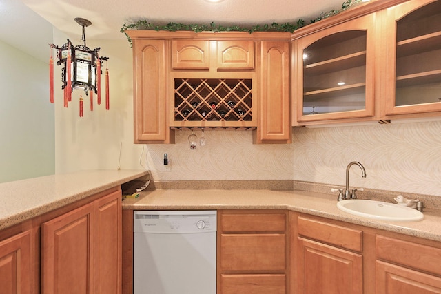 203 Foxwood Ct, Columbia, MO 65203 - kitchen with dishwasher, light countertops, glass insert cabinets, and hanging light fixtures