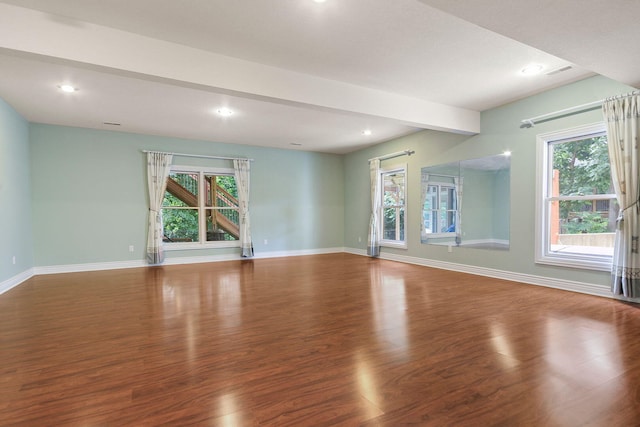 203 Foxwood Ct, Columbia, MO 65203 - unfurnished living room with wood finished floors, healthy amount of natural light, recessed lighting, and beamed ceiling