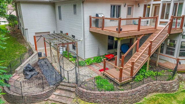 203 Foxwood Ct, Columbia, MO 65203 - rear view of house featuring a deck, a pergola, a patio area, and stairs