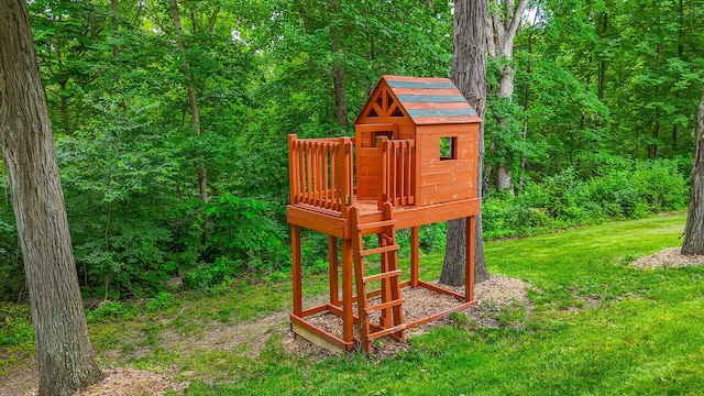 203 Foxwood Ct, Columbia, MO 65203 - view of playground featuring a lawn and a forest view