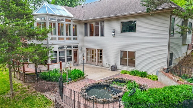 203 Foxwood Ct, Columbia, MO 65203 - back of property with a patio and an in-ground hot tub