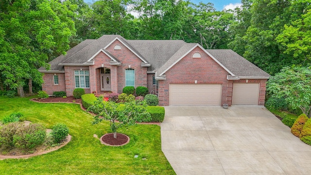 203 Foxwood Ct, Columbia, MO 65203 - view of front of house featuring a garage, brick siding, concrete driveway, and a front lawn