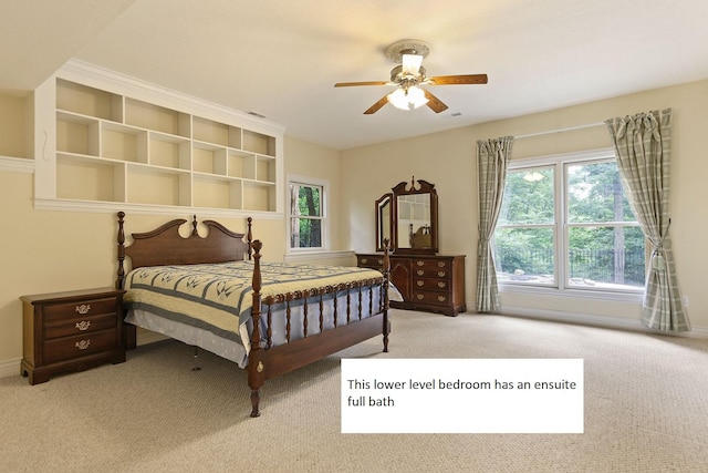 203 Foxwood Ct, Columbia, MO 65203 - carpeted bedroom featuring multiple windows and ceiling fan