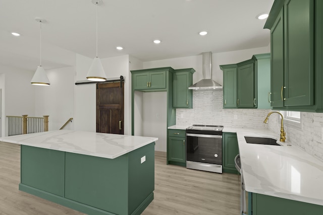 1704 Stillpoint Ct, Columbia, MO 65203 - kitchen with green cabinets, stainless steel range with electric stovetop, wall chimney exhaust hood, light wood-style flooring, and recessed lighting