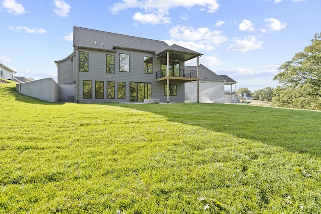 1704 Stillpoint Ct, Columbia, MO 65203 - back of house with a balcony and a lawn