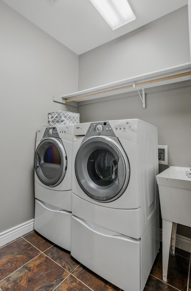 1600 Andretti Cir, Columbia, MO 65201 - washroom with washing machine and clothes dryer and dark stone finish floors