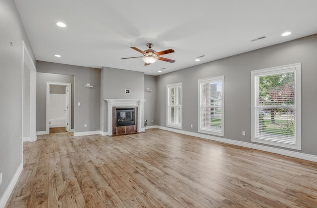1600 Andretti Cir, Columbia, MO 65201 - unfurnished living room with light wood finished floors, a ceiling fan, recessed lighting, and a fireplace with flush hearth