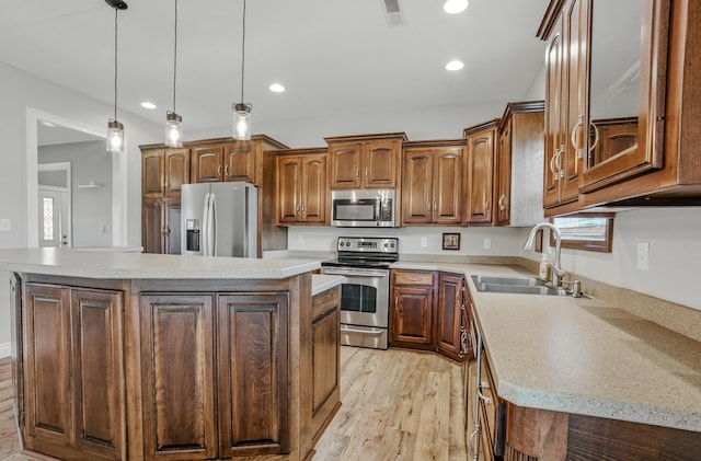 1600 Andretti Cir, Columbia, MO 65201 - kitchen featuring stainless steel appliances, light wood-style floors, light countertops, a center island, and recessed lighting