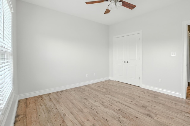 1600 Andretti Cir, Columbia, MO 65201 - unfurnished bedroom featuring light wood finished floors, a closet, and a ceiling fan