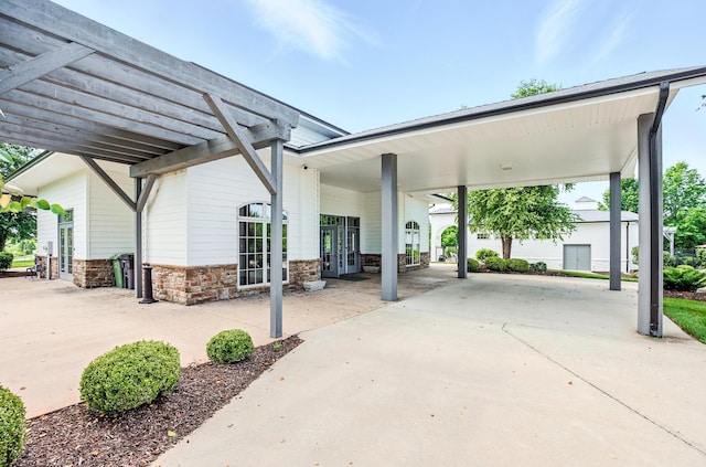 1600 Andretti Cir, Columbia, MO 65201 - view of patio featuring french doors and driveway