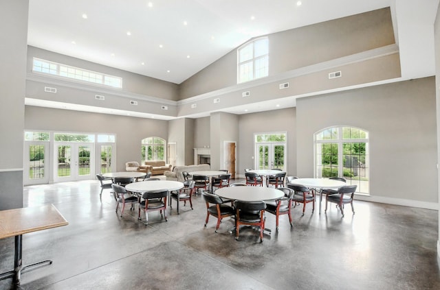 1600 Andretti Cir, Columbia, MO 65201 - dining room with finished concrete floors, high vaulted ceiling, and recessed lighting