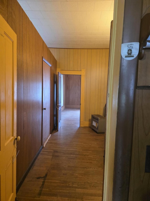 523 W Locust St, Paris, MO 65275 - hallway featuring dark wood finished floors and wooden walls