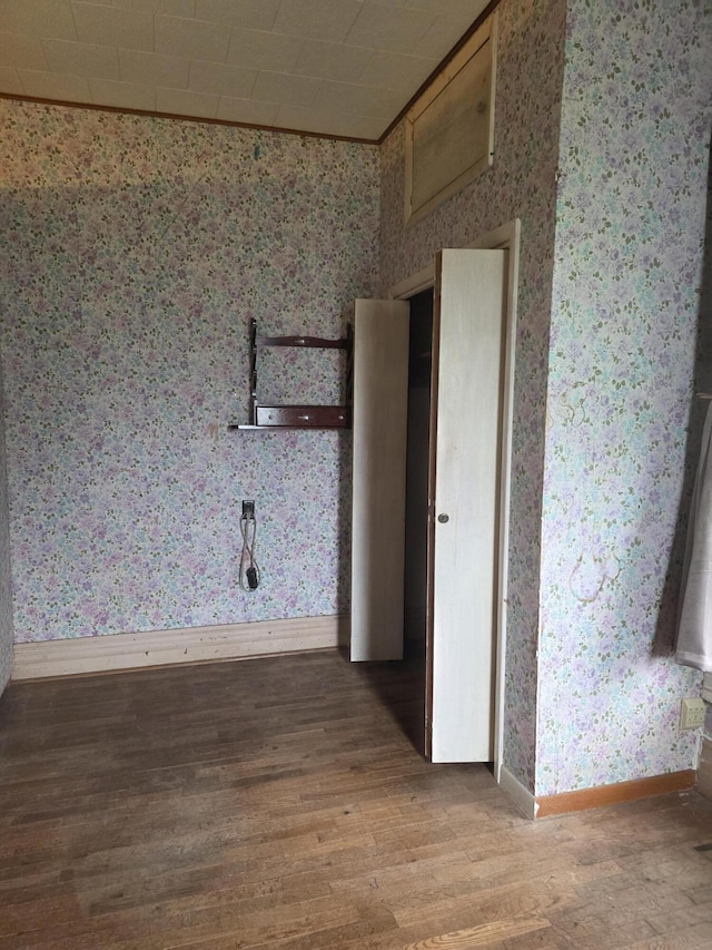 523 W Locust St, Paris, MO 65275 - unfurnished room featuring wallpapered walls and wood finished floors