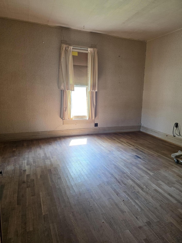 523 W Locust St, Paris, MO 65275 - unfurnished room with dark wood-style floors and baseboards