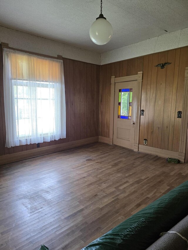 523 W Locust St, Paris, MO 65275 - entrance foyer featuring wood finished floors and wood walls