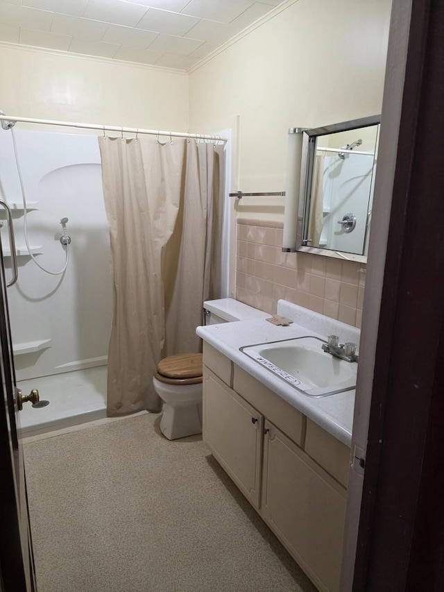 523 W Locust St, Paris, MO 65275 - full bath with a shower with curtain, vanity, ornamental molding, tile walls, and backsplash