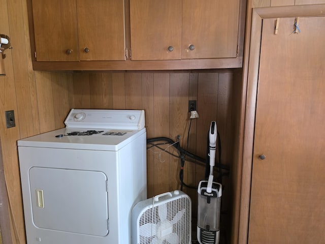 523 W Locust St, Paris, MO 65275 - laundry room featuring washer / clothes dryer, cabinet space, and wood walls