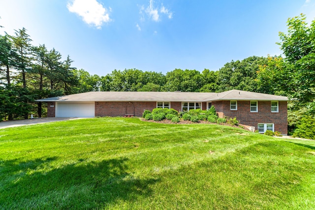 4705 Roemer Rd, Columbia, MO 65202 - ranch-style home featuring brick siding, asphalt driveway, an attached garage, and a front lawn