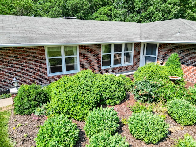 4705 Roemer Rd, Columbia, MO 65202 - view of front of house featuring brick siding and roof with shingles