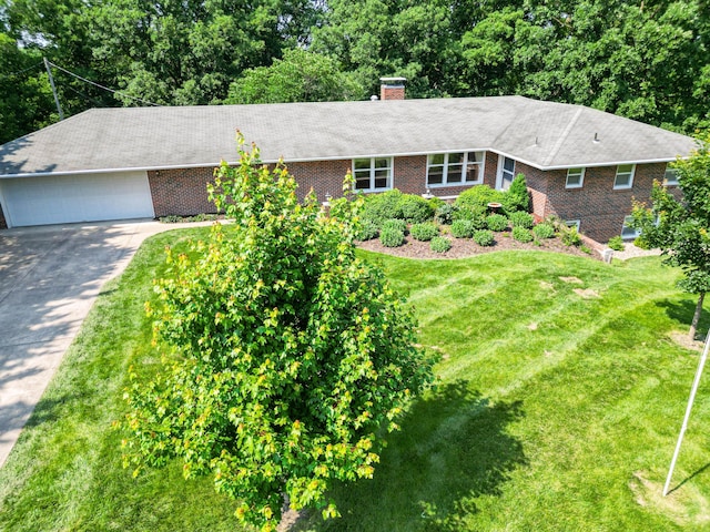 4705 Roemer Rd, Columbia, MO 65202 - single story home featuring brick siding, concrete driveway, a front lawn, a garage, and a chimney